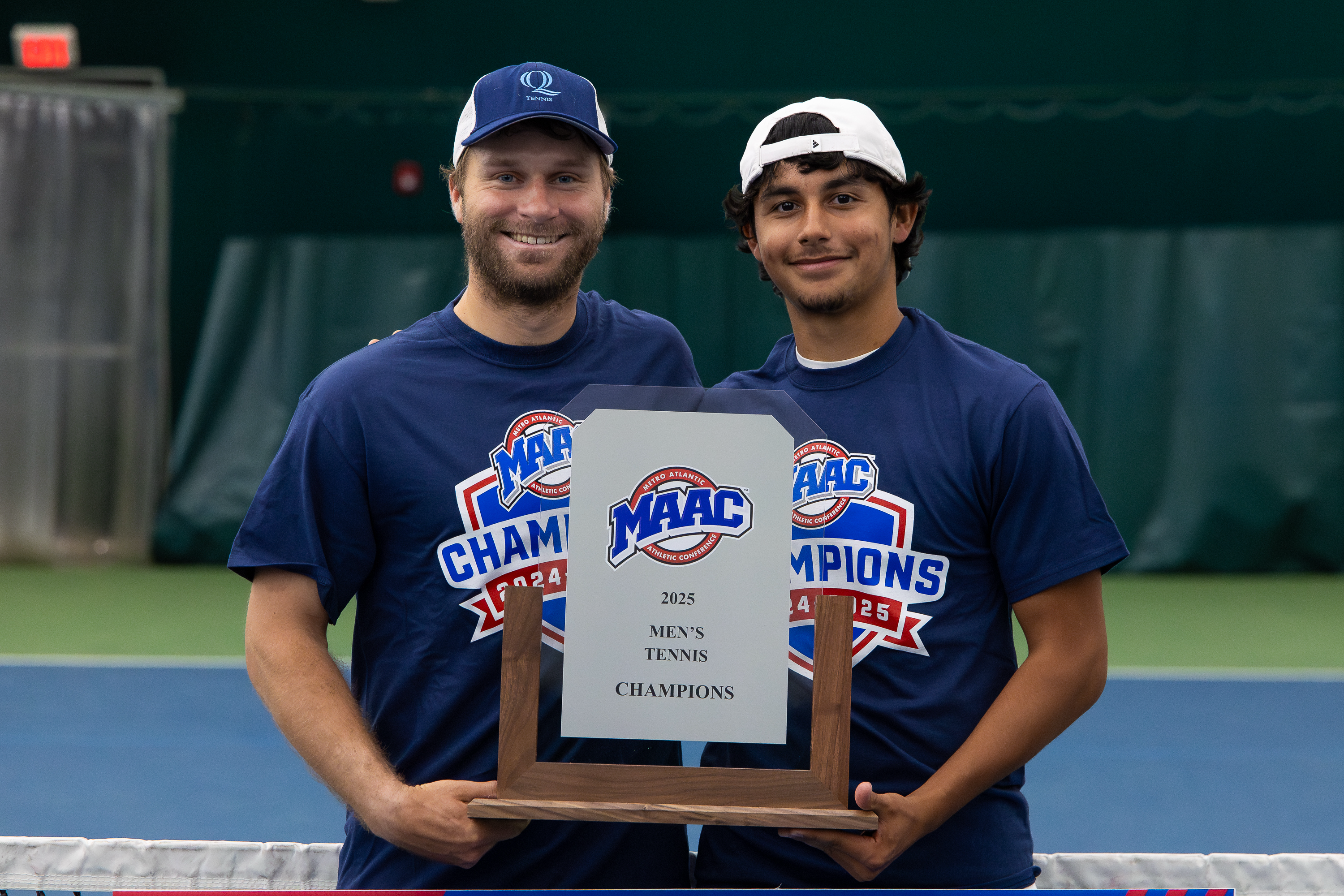 Daniel Velek (left) and James Lorenzetti (right) holding the 2025 MAAC Men's Tennis Championship trophy.